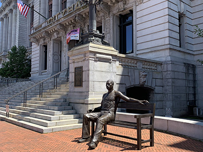 Photo of Newark City hall with a statue of George Floyd in front.